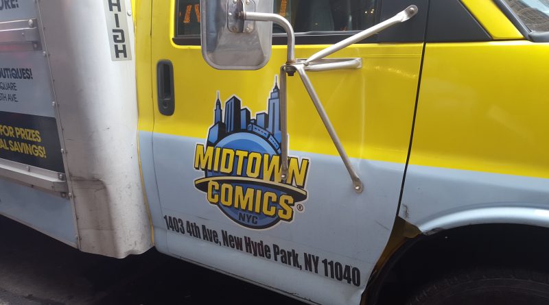The Midtown Comics Truck parked in front of it's store filled with boxes of free comics. Photo Credit: Anthony Medina